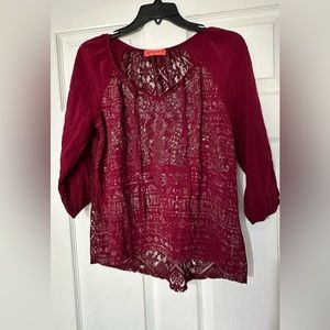 Spoiled quarter sleeve ladies blouse is a size small.